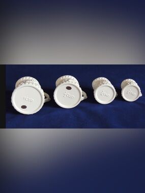 Vintage White Ceramic Measuring Pitcher Set Of 4.. Embossed Grapes